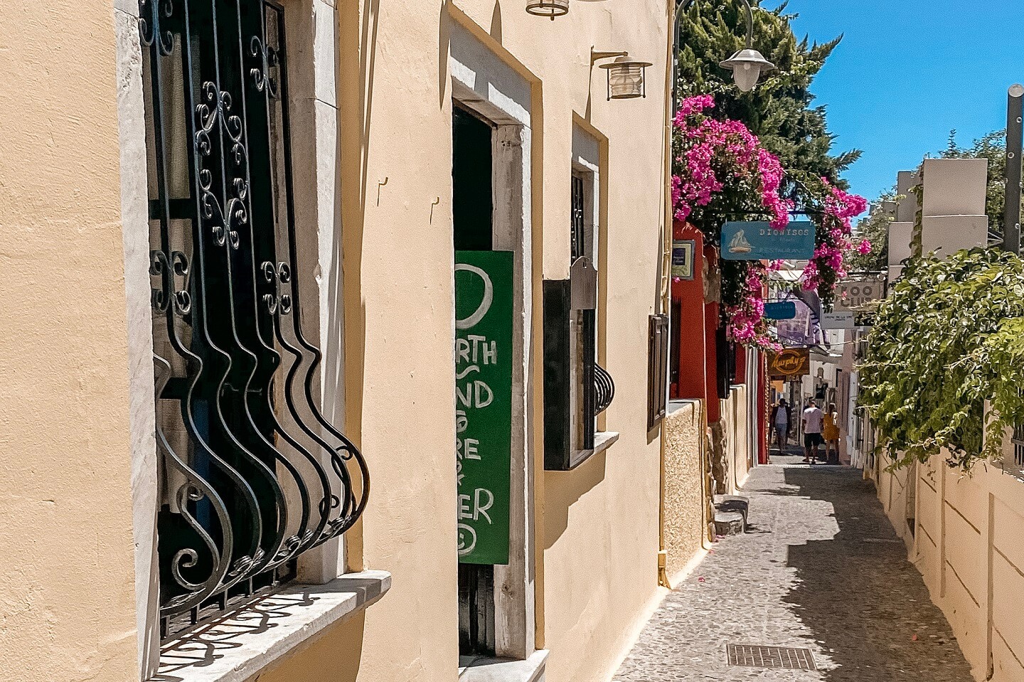 Narrow alley with shops on Greek island