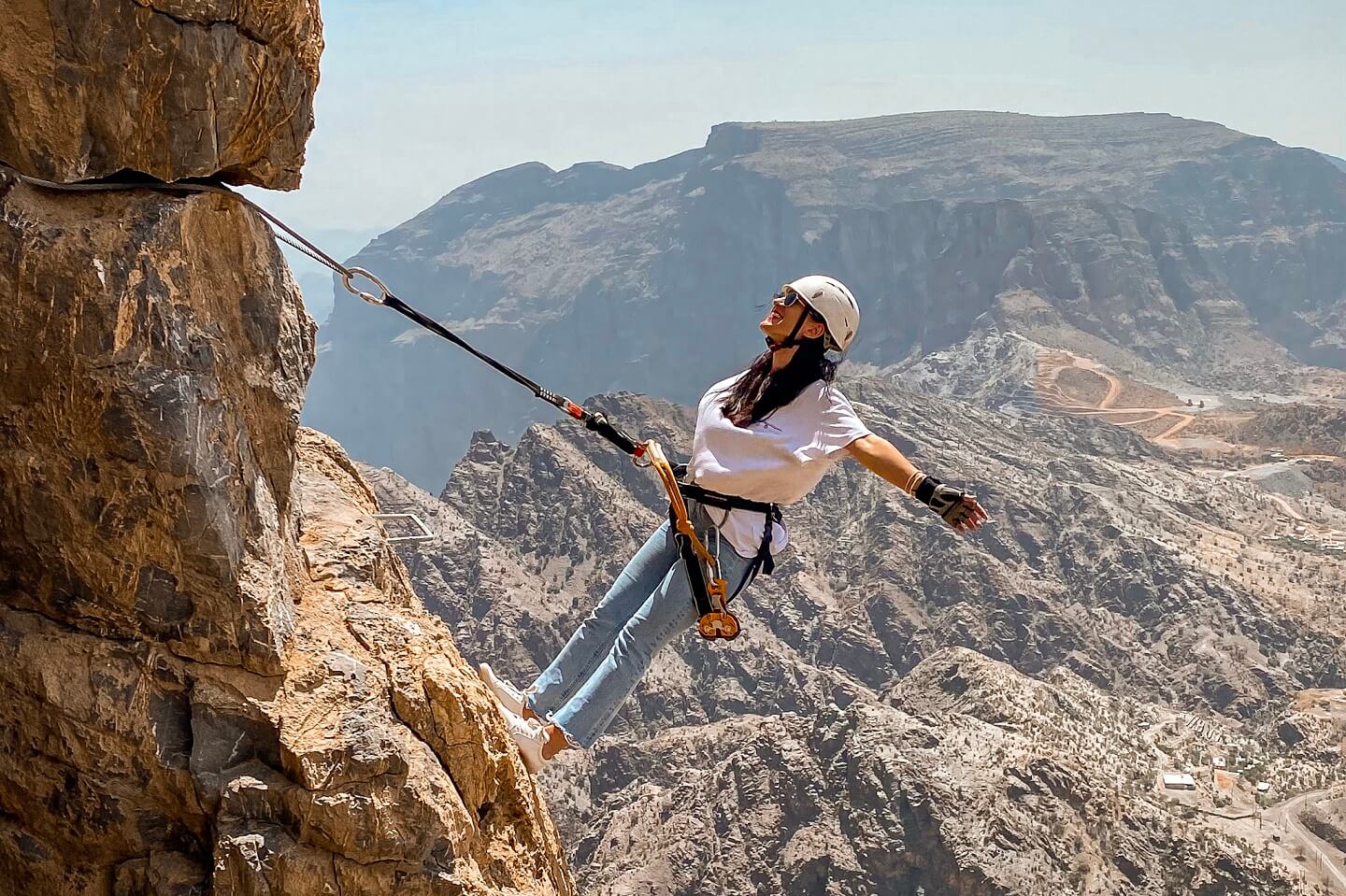 Girl climbing Jabal Akhdar Mountains Oman