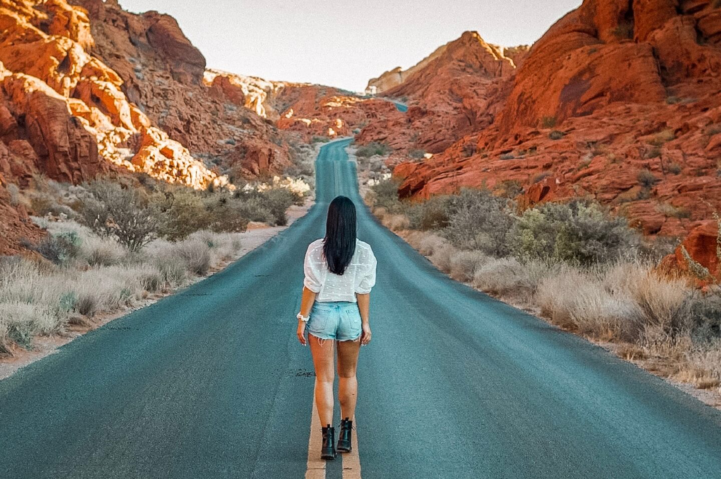 Girl walking in the middle of the street 