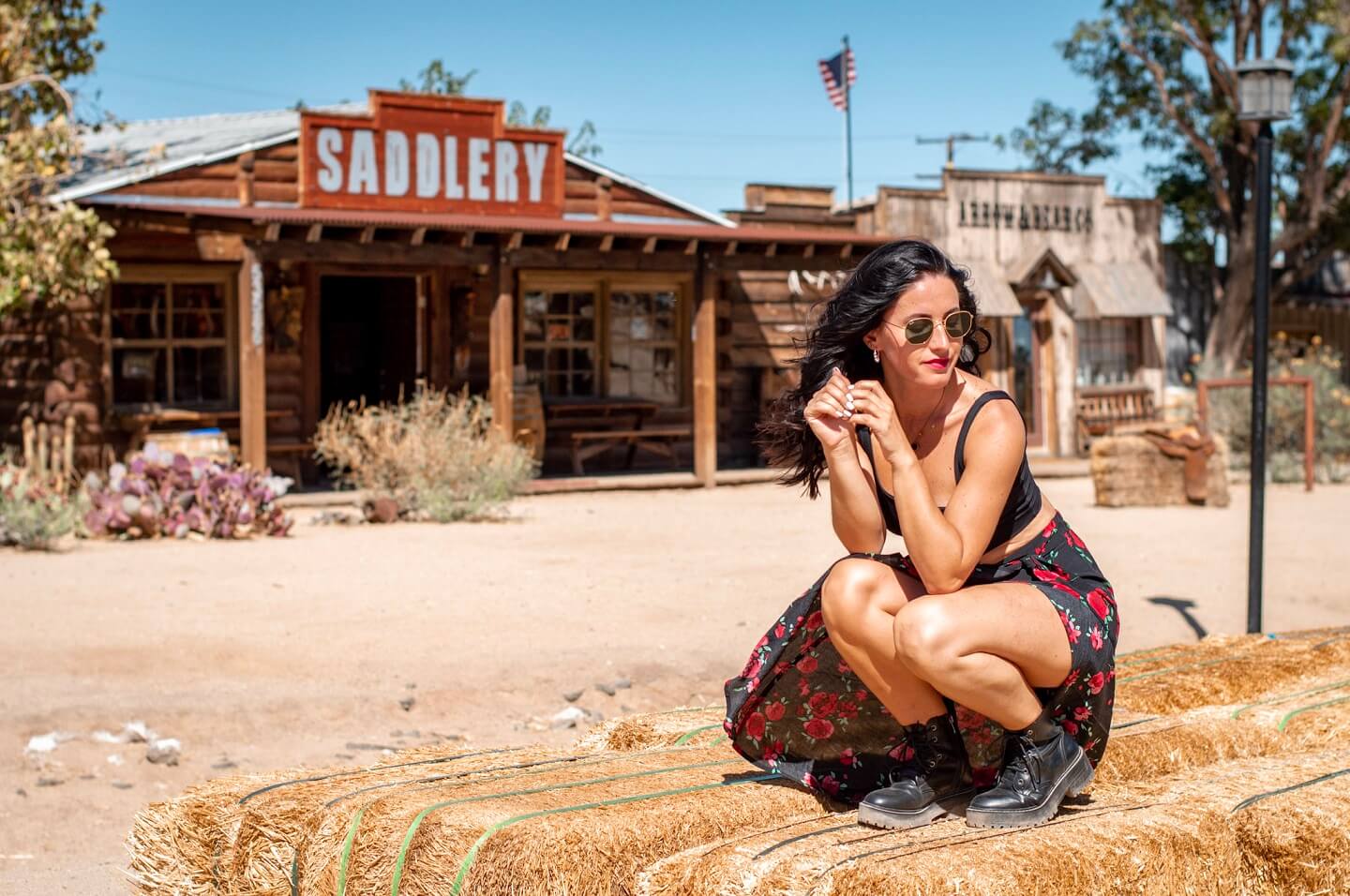 Girl squat pose for instagram in Ghost town