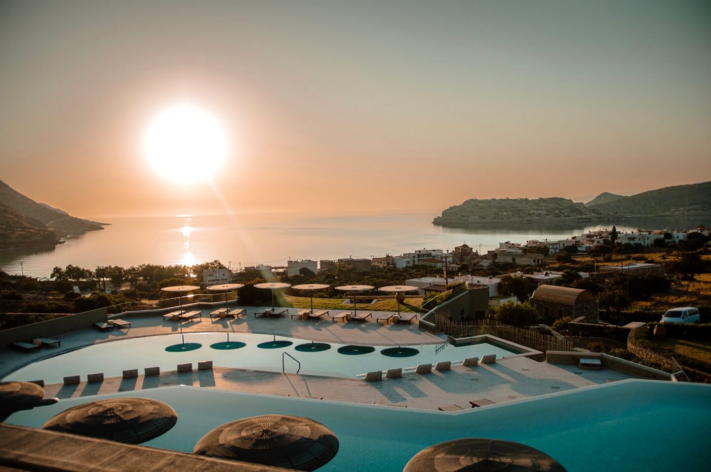 Cayo Resort Plaka Crete. View of swimmining pools during the sunrise