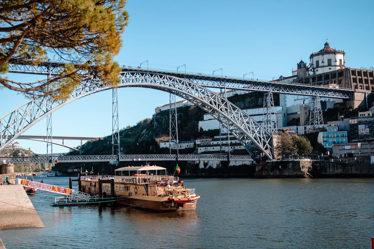 River bridge and river boat in Porto